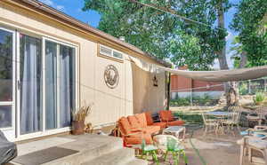 View of patio with an outdoor living space