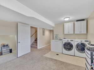 Washroom featuring cabinets, independent washer and dryer, hookup for a washing machine, and light colored carpet