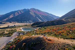 Property view of mountains featuring a water view