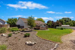 View of yard featuring a wooden deck