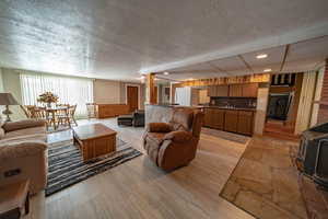 Living room with full kitchen and access to the garage.