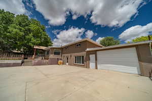 View of front of property with a garage and extra bonus area with second kitchen.