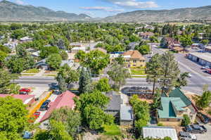 Birds eye view of property with a mountain view