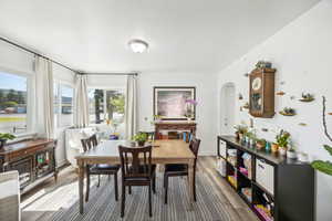 Dining space with wood-type flooring