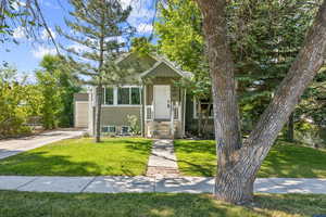 View of front of property with a front yard