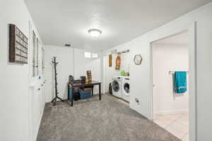 Family room with washer and clothes dryer