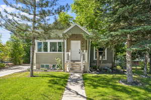 View of front of property with a front yard