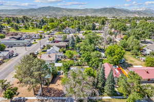 Birds eye view of property with a mountain view