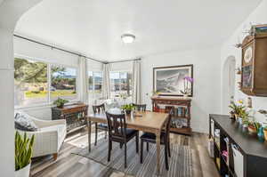 Dining room featuring a healthy amount of sunlight and hardwood / wood-style floors