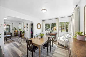 Dining room featuring hardwood / wood-style flooring and a wealth of natural light