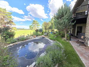 Exterior space featuring a patio area and a lawn