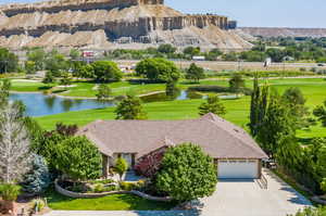 Exterior space featuring a lawn and a water view