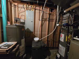 Utility room featuring water heater