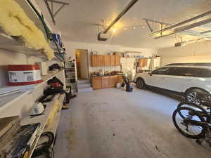 Garage featuring a garage door opener