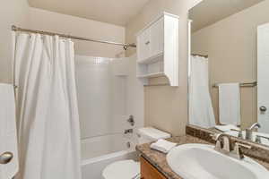 Full bathroom featuring vanity with shower / tub combo