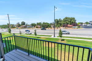 Wooden deck featuring a lawn