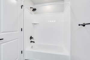 Bathroom featuring shower / washtub combination