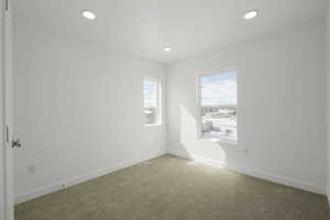 Unfurnished room with carpet floors