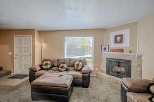 Tiled living room with a tiled fireplace