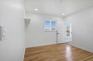 Spare room featuring light hardwood / wood-style flooring