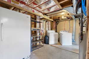 Basement featuring washing machine and clothes dryer