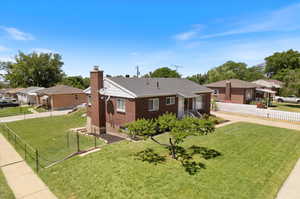 View of front facade with a front yard and a garage