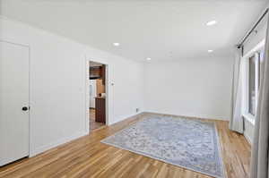 Unfurnished room with light hardwood / wood-style floors