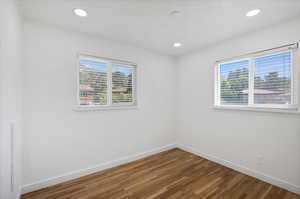 Spare room featuring hardwood / wood-style floors