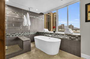 Indulge in the lavish en-suite bathroom with stunning city views.