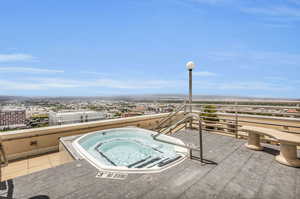 Roof top jacuzzi offering stunning city and mountain views.