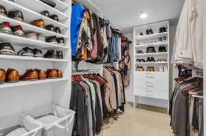 Walk-in closet providing ample storage and organization for your wardrobe essentials.