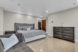 Spacious primary bedroom with walk in closet.