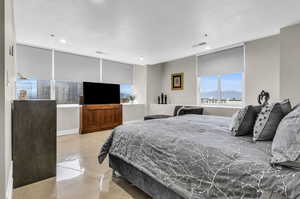 Enjoy City views from the comfort of your bed, Adjust the privacy blinds with the touch of a button.