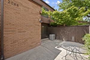 View of patio featuring central air condition unit