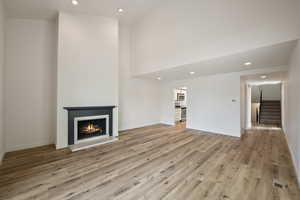 Unfurnished living room with light hardwood / wood-style floors