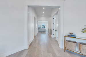 Hallway featuring light hardwood / wood-style floors