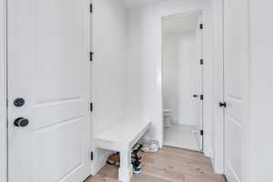 Mudroom with light hardwood / wood-style floors