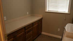 Bathroom featuring tile flooring and washer / dryer