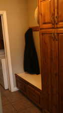 Mudroom featuring tile flooring and washer / clothes dryer