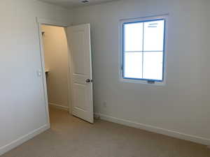 View of carpeted spare room