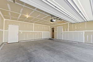 Garage featuring a garage door opener