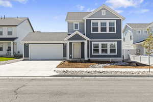 View of front of property with a garage