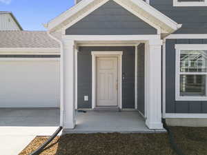 Property entrance featuring a garage