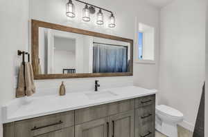 Bathroom with vanity and toilet