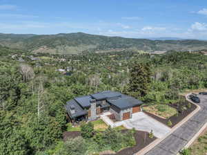 Birds eye view of property with a mountain view