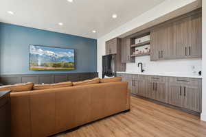 Living room featuring recessed lighting and light wood-style floors