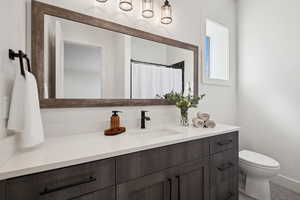 Full bathroom featuring vanity and toilet