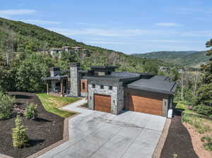 View of front of house featuring a garage and a mountain view