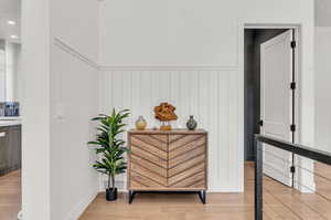 Corridor featuring light hardwood / wood-style flooring