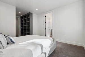 Bedroom featuring carpet floors, baseboards, and recessed lighting